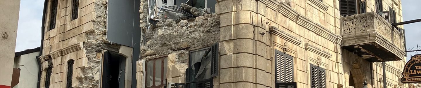 Street in Antakya, Turkey with historical building damaged by earthquake